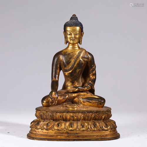 A BRONZE GILT SEATED SAKYAMUNI