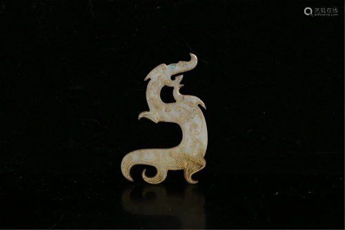 A JADE CARVED DRAGON PENDANT