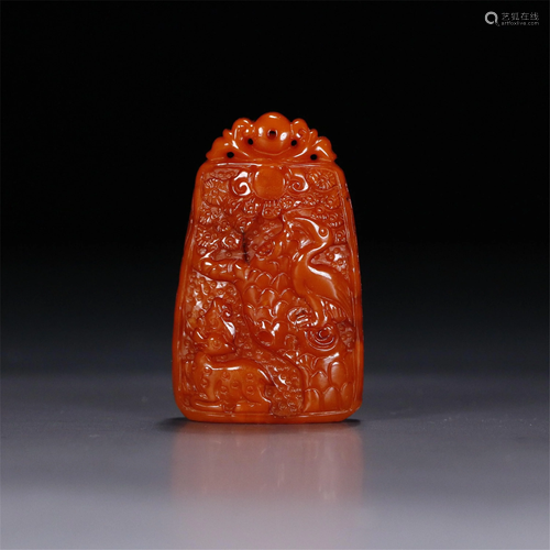 A CLOUDY AMBER CARVED DEER-AND-CRANE PENDANT