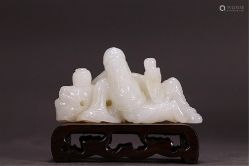 A JADE CARVING OF FIGURES STORY