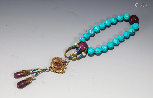 A STRING OF TURQUOISE PRAYER BEADS