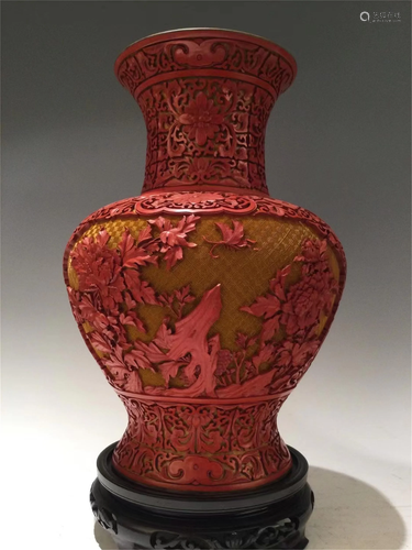 A CARVED LACQUER BUTTERFLY-AND-FLOWER VASE