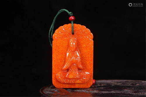 A YELLOW JADE CARVED AVALOKITESVARA PENDANT