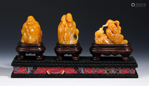 A GROUP OF THREE SOAPSTONE CARVED FIGURINES