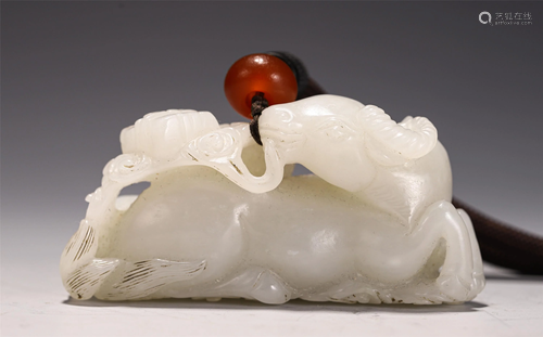 A JADE CARVING OF MYTHICAL BEAST