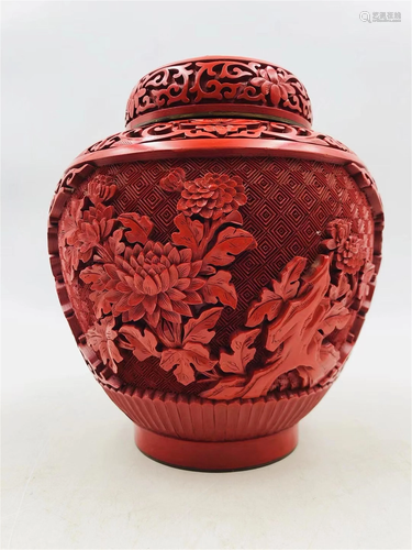 A CARVED RED LACQUER TEA-LEAF JAR AND COVER