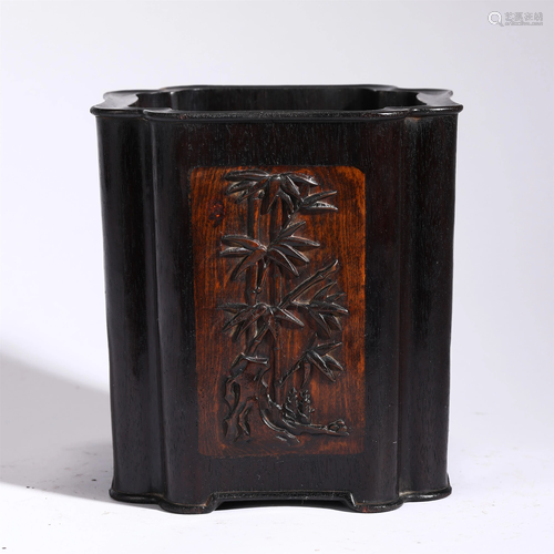 A HARDWOOD CARVED FLORAL BRUSH POT