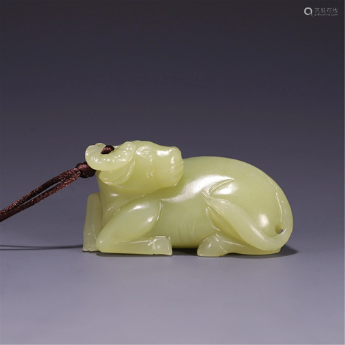 A YELLOW JADE CARVED BUFFALO