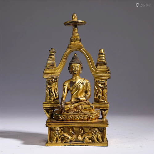 A BRONZE GILT SEATED SAKYAMUNI