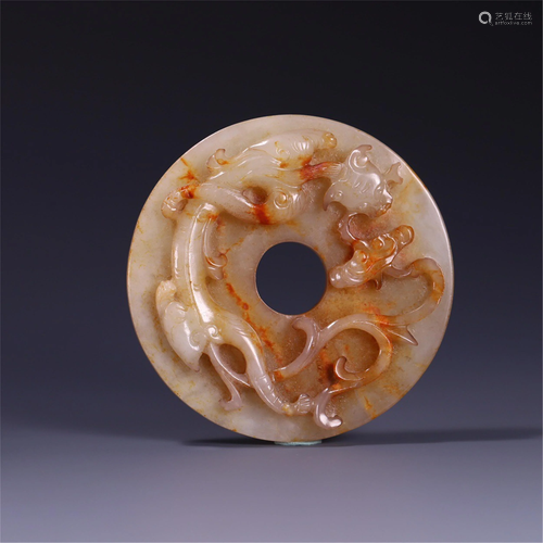 A CARVED DRAGON JADE BI