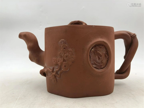 A CARVED YIXING CLAY TEA POT