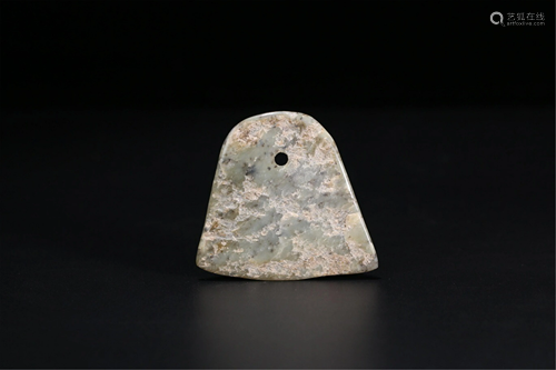 AN AXE SHAPED JADE PENDANT