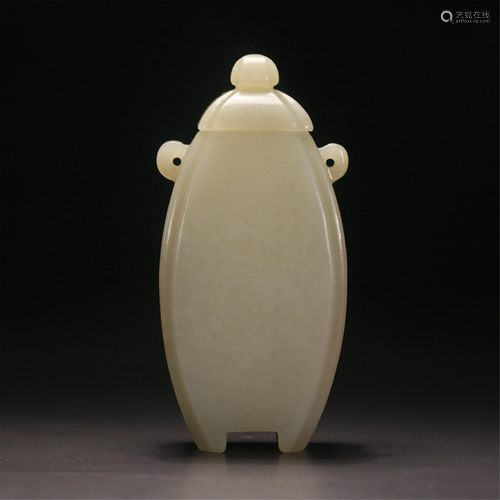 A CARVED JADE VASE WITH DOUBLE HANDLES