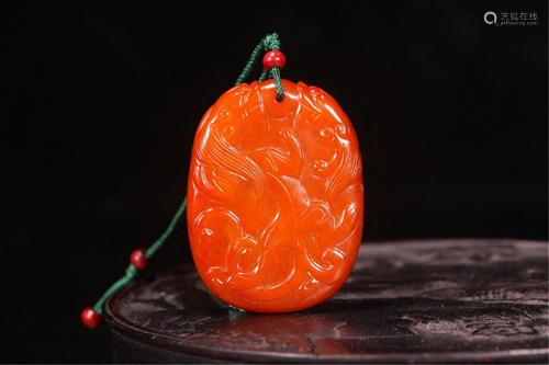 A YELLOW JADE CARVED DRAGON PENDANT