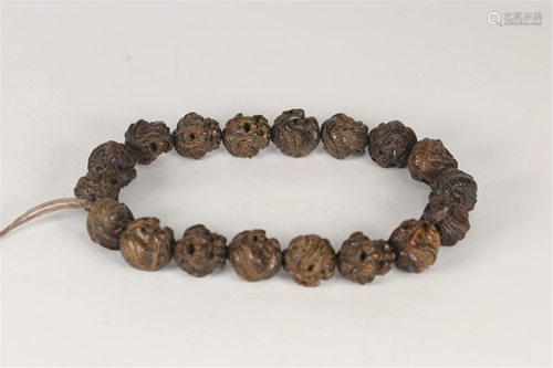 A STRING OF CHENXIANG WOOD CARVED PRAYER BEADS