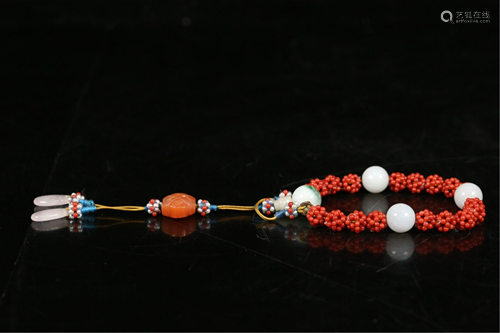 A STRING OF CORAL-BEAD PRAYER BEADS