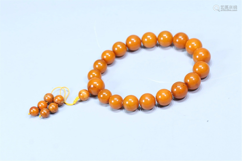 A STRING OF CLOUDY AMBER PRAYER BEADS