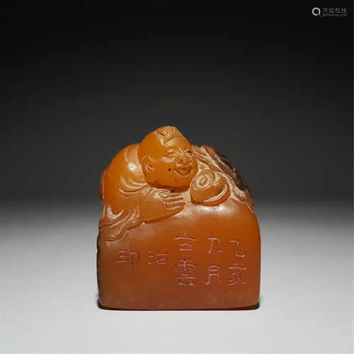 A SOAPSTONE CARVED FIGURAL SEAL