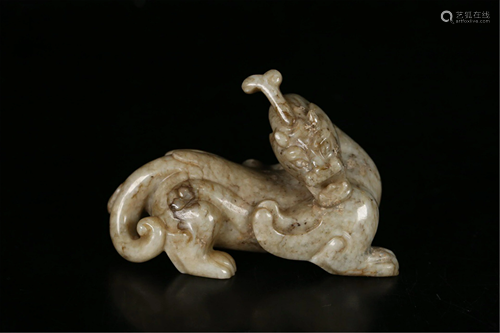 A JADE MYTHICAL BEAST CARVING