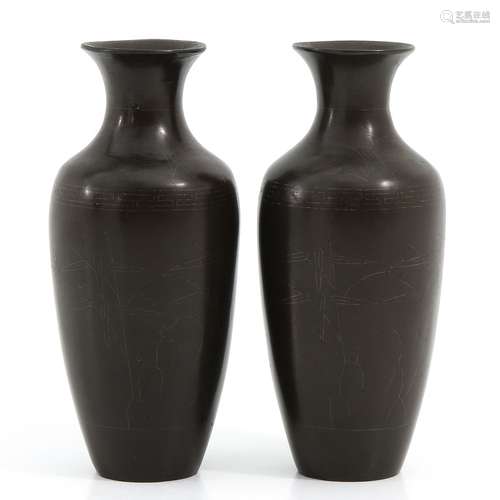 A Pair of Bronze Shi Shou Vases