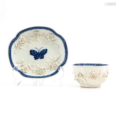 A blue and white cup and saucer