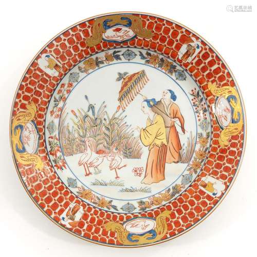 An Orange and Gilt Decor Plate