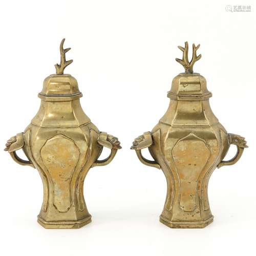 A Pair of Bronze Vases with Covers