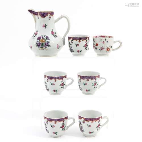 A Famille Rose Pitcher and Cups