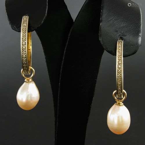 A Pair of 14KG Diamond Earrings