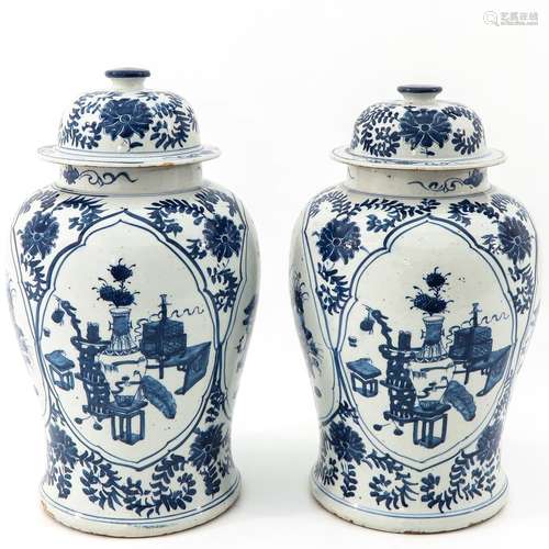 A Pair of Blue and White Jars with Covers