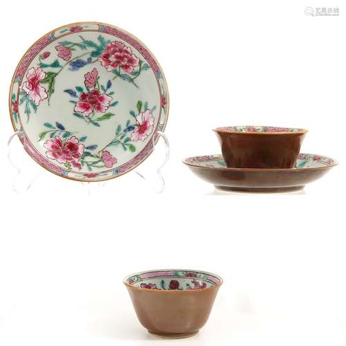 A pair of famille rose cups and saucers