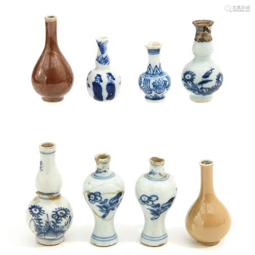 A Collection of Miniature 8 Vases