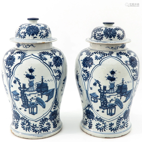 A Pair of Blue and White Jars with Covers