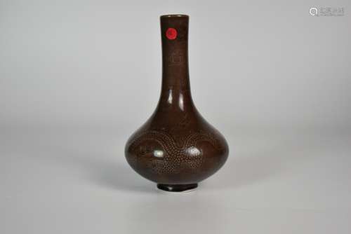 An Aubergine Glazed incised Dragon Pattern Vase