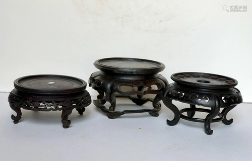 Three Carved Wood Stands with Raised Legs