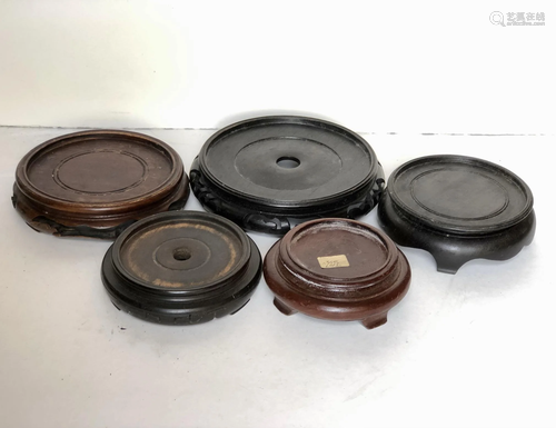 Five Carved Round Wood Stands in Various Sizes