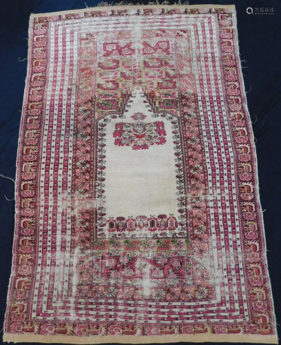 Ghiordes prayer rug. Probably antique, around 1800.