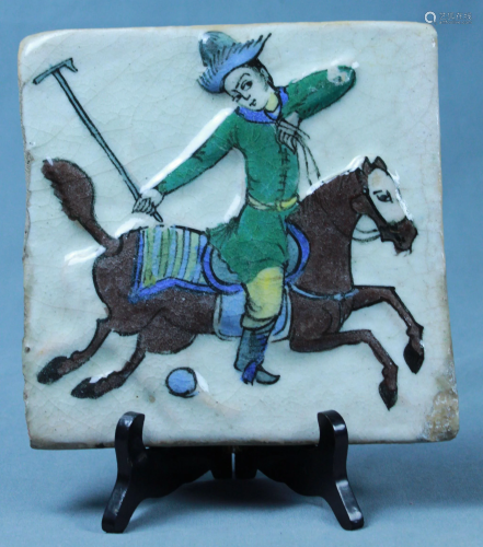 Tile with polo player.