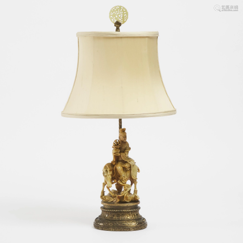 A Chinese Soapstone Carved Figure Mounted as a Lamp,