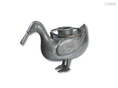 A Tin Bird Tea Pot