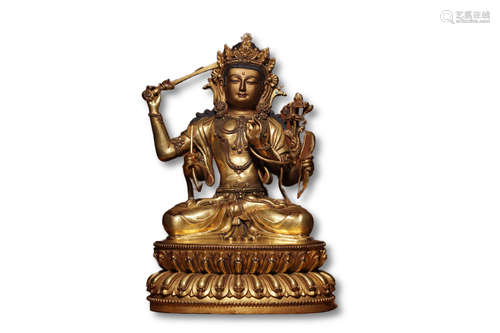 A Gilt Bronze Four Arm Guanyin Figure Statue