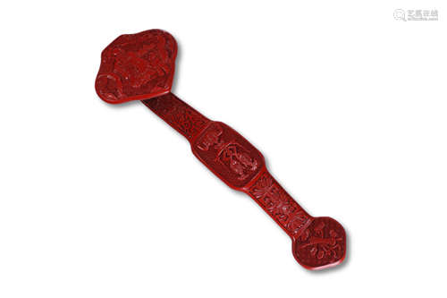 A Carved Red Lacquer Ruyi Ornament