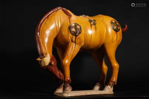 Yellow glazed sweaty horse in Tang Dynasty