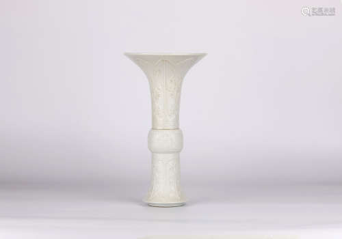 A white glazed flower vase