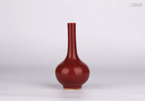 A red glazed vase