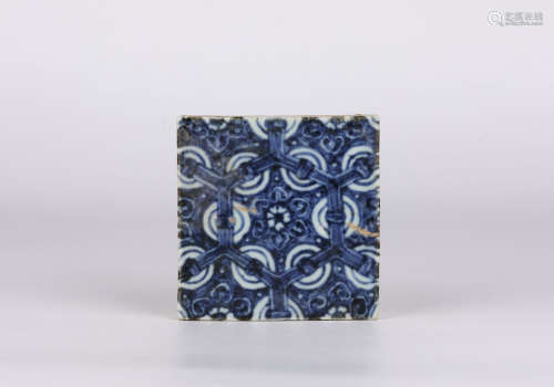 A blue and white ceramic tile