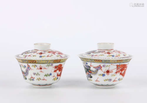 A pair of famille-rose 'dragon and phoenix' bowl and cover