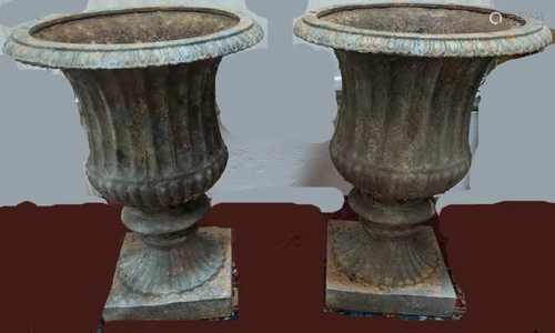 A pair of cast iron garden urns, H.53cm