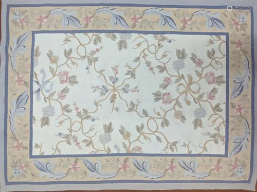 An Aubusson style embroidered rug with floral designs,