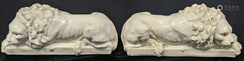 A pair of early 20th century white ceramic lions